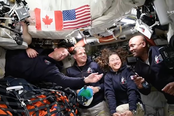 Artemis II astronauts, from left, Reid Wiseman, Jeremy Hansen, Christina Koch and Victor Glover gather for an interview en route to the moon.