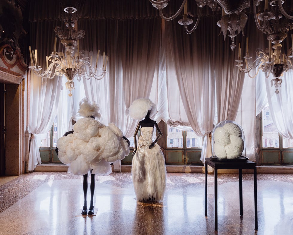 Fashion display featuring avant-garde garments in a sophisticated setting.