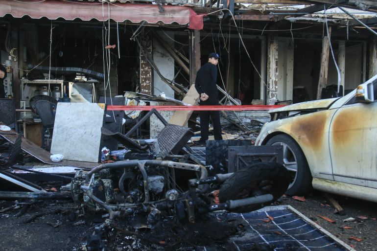 A man assesses the damage at the site of an overnight Israeli airstrike in Sidon, southern Lebanon, on April 8, 2026.