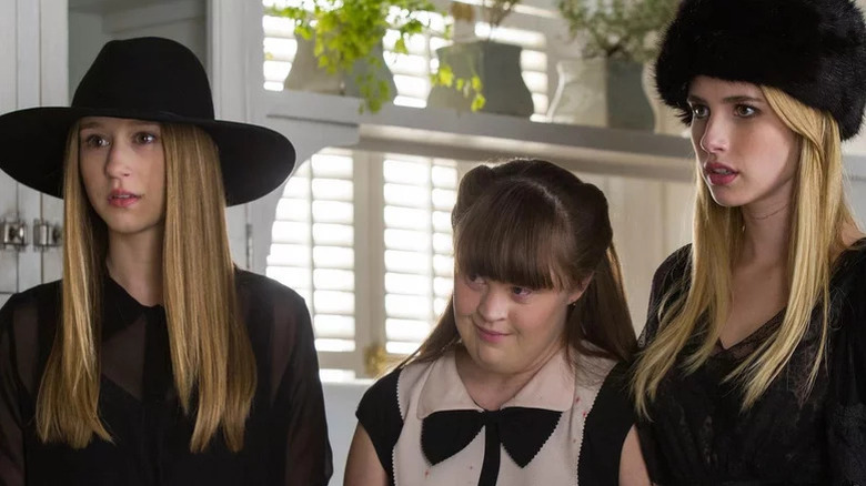 Taissa Farmiga's  Zoe Benson, Jamie Brewer's Nan, and Emma Roberts' Madison Montgomery wearing fancy clothes on American Horror Story: Coven