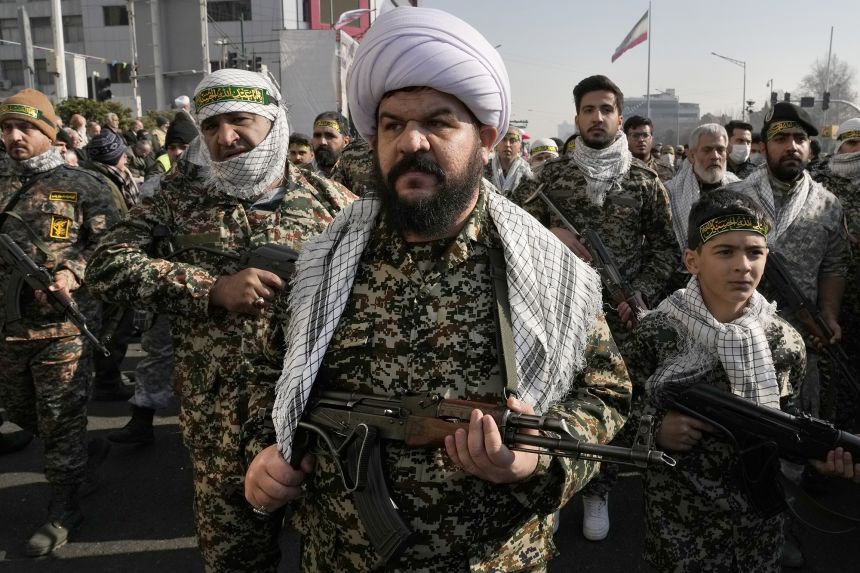 Members of the Iran's Basij paramilitary force march during a military parade held in the capital Tehran on January 10, 2025.