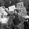 Rev. Ben Chavis, right, raises his fist as fellow protesters are taken to jail at the Warren County PCB landfill near Afton, N.C., on Sept. 16, 1982.