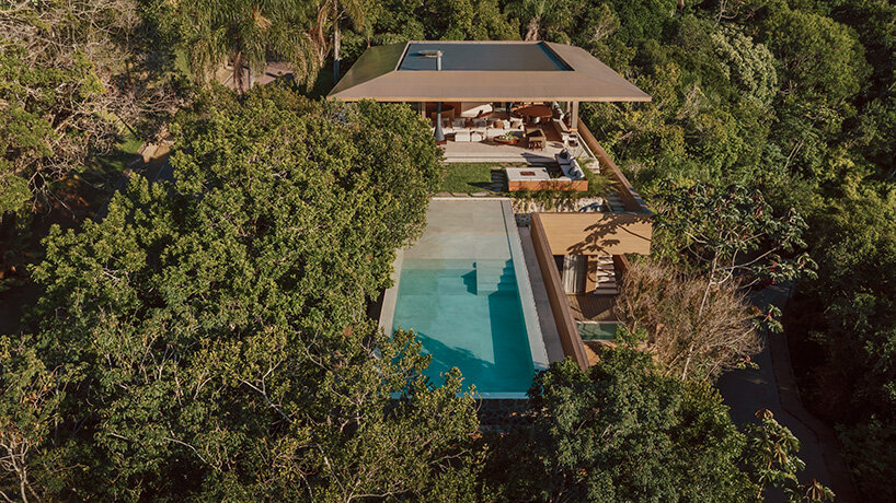 arthur casas adapts speculative structure into wood-lined coastal house in brazil - 3
