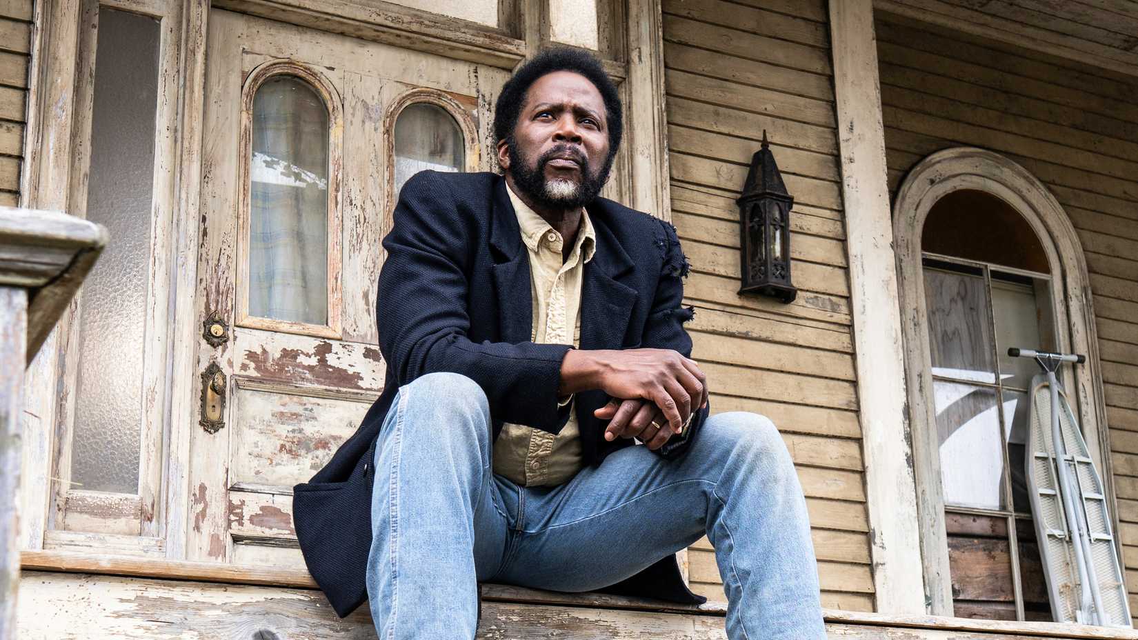 Boyd sitting on the Colony House porch in From season 4