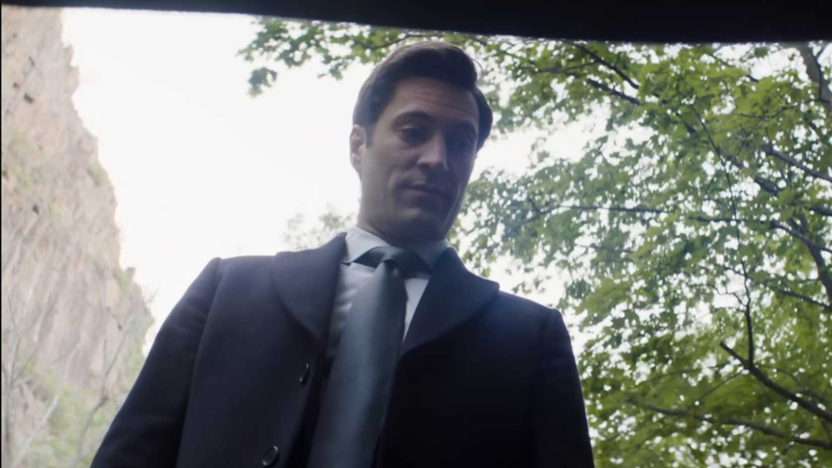 Buck looking down into a trunk in Daredevil Born Again season 2