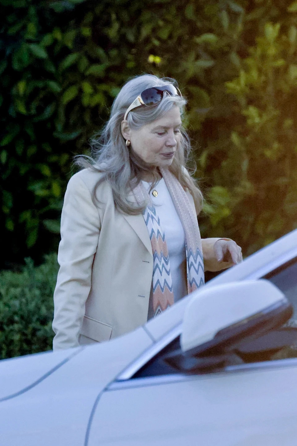 She accessorized with gold sunglasses. BACKGRID