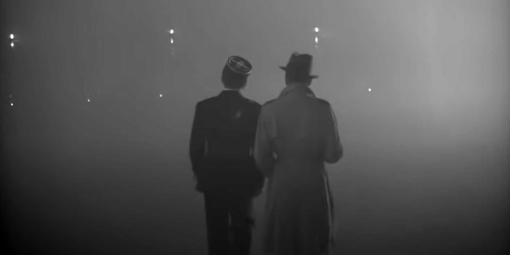 Two men walking away into the mist in Casablanca