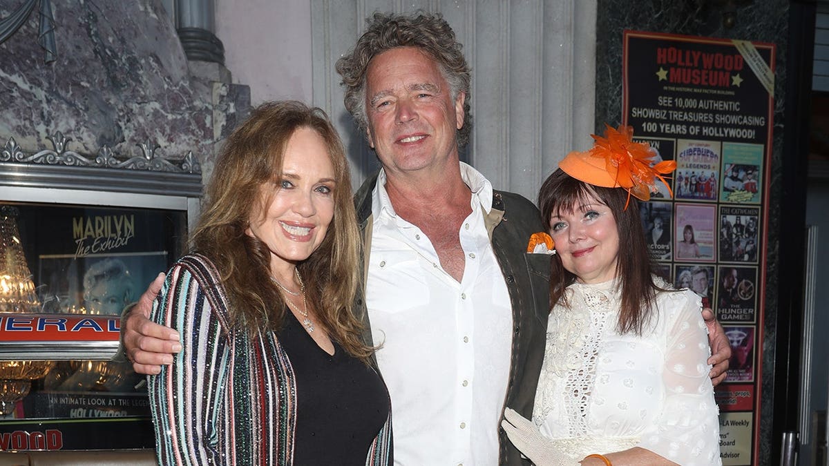 Catherine Bach, John Schneider and Dee Dee Sorvino standing together in Los Angeles