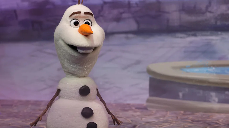 This photograph shows the character Olaf talking about the new World of Frozen, inside the Disney Adventure World