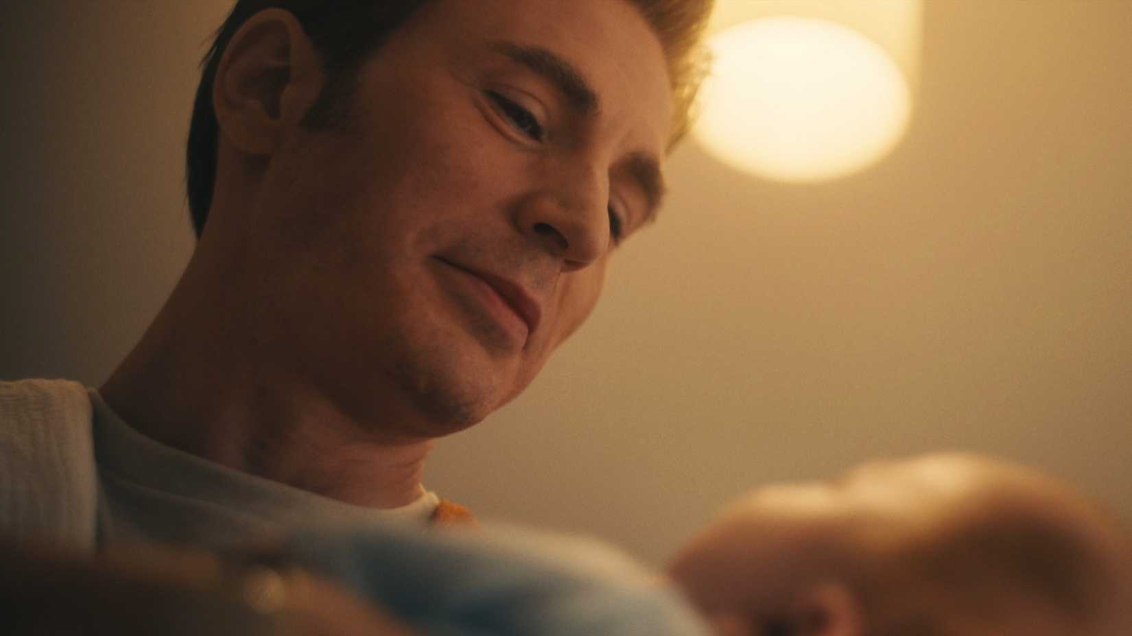 Chris Evans as Steve Rogers looking at his child in Avengers: Doomsday