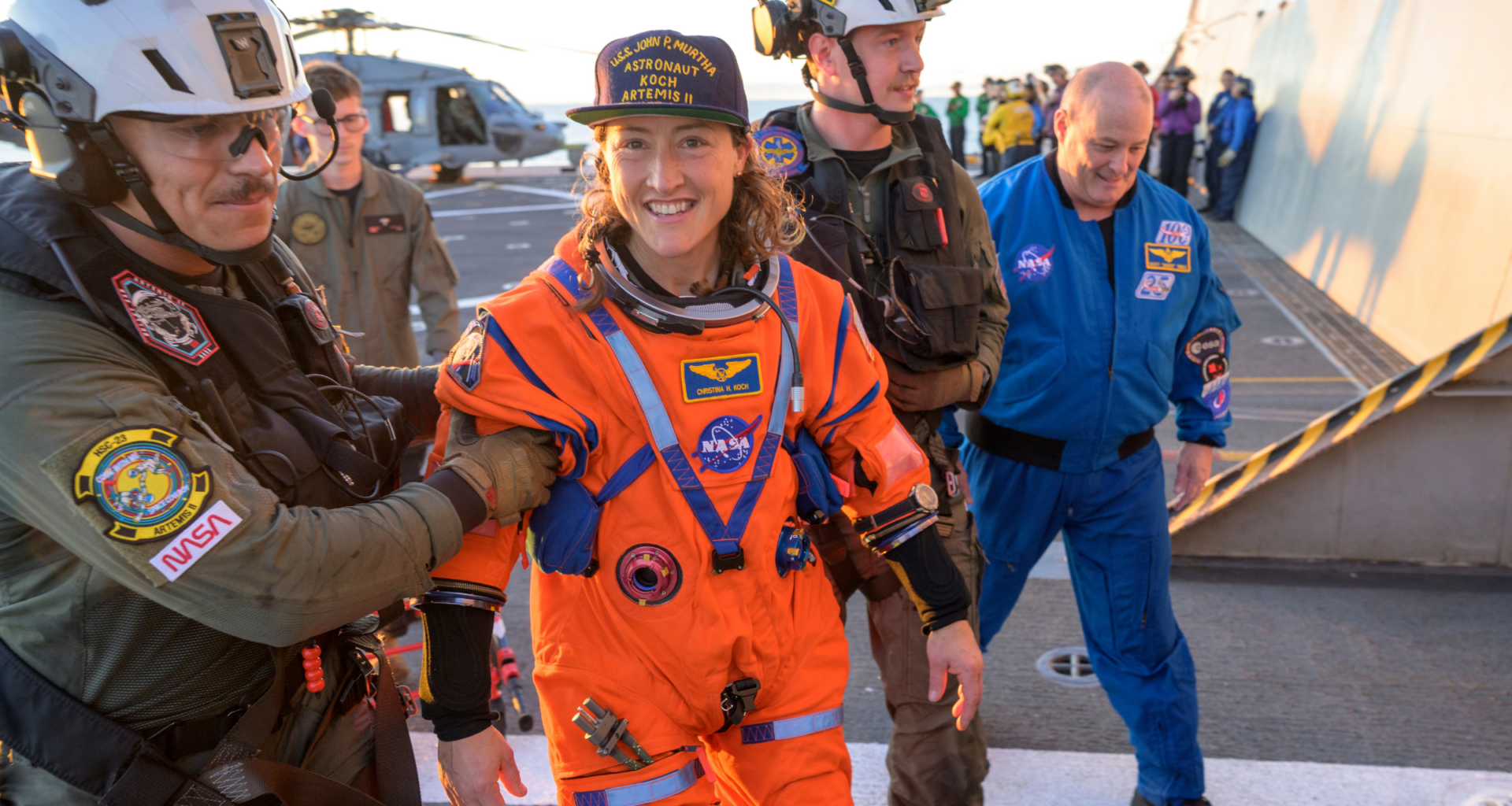 NASA astronaut Christina Koch smiling shortly after the Artemis II splashdown