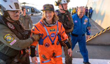 NASA astronaut Christina Koch smiling shortly after the Artemis II splashdown