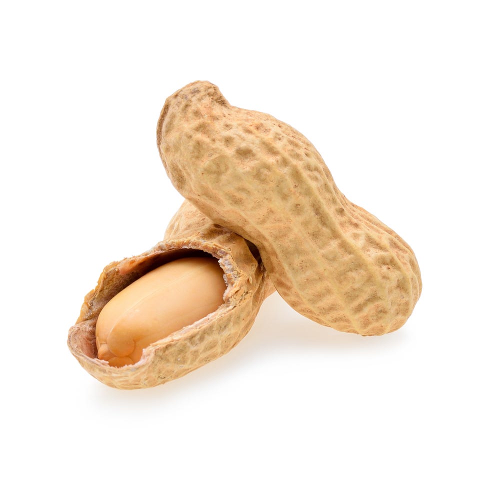 Close-Up Of Peanuts Against White Background Close-Up Of Peanuts Against White Background