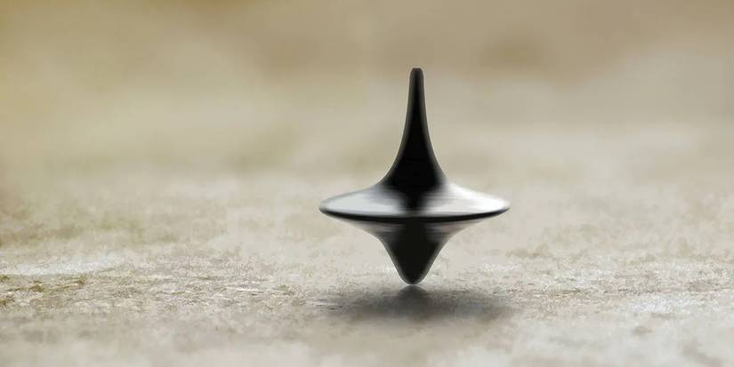 Cobb's totem, a tiny top, standing on end at the conclusion of Inception.