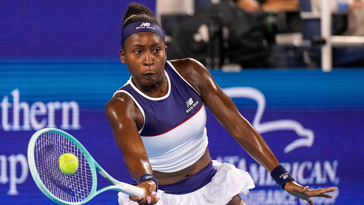 Coco Gauff returning a shot during a tennis match at the Lindner Family Tennis Center