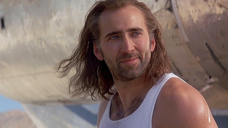 Nicolas Cage as Cameron, drying his hair in Con Air