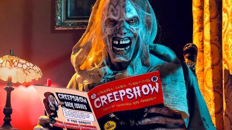 The Creep looks up from reading a Creepshow comic book in Creepshow