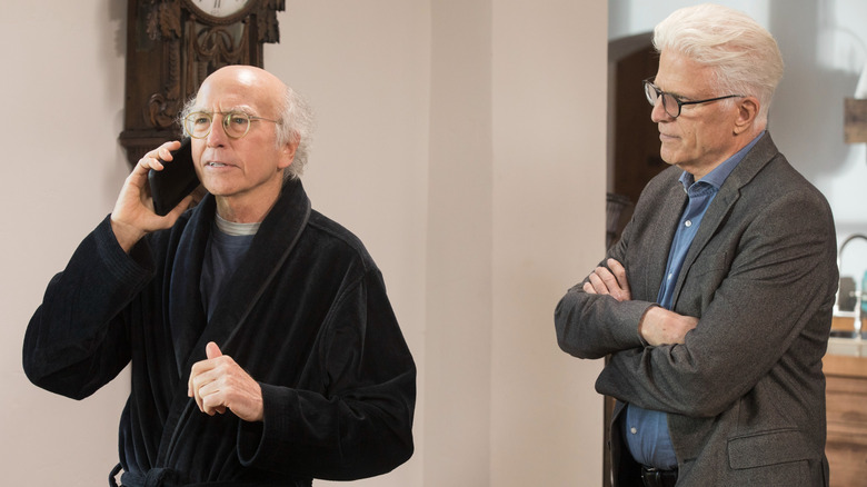 Ted Danson crossing his arms and glaring at Larry David, who's on the phone in a bathrobe