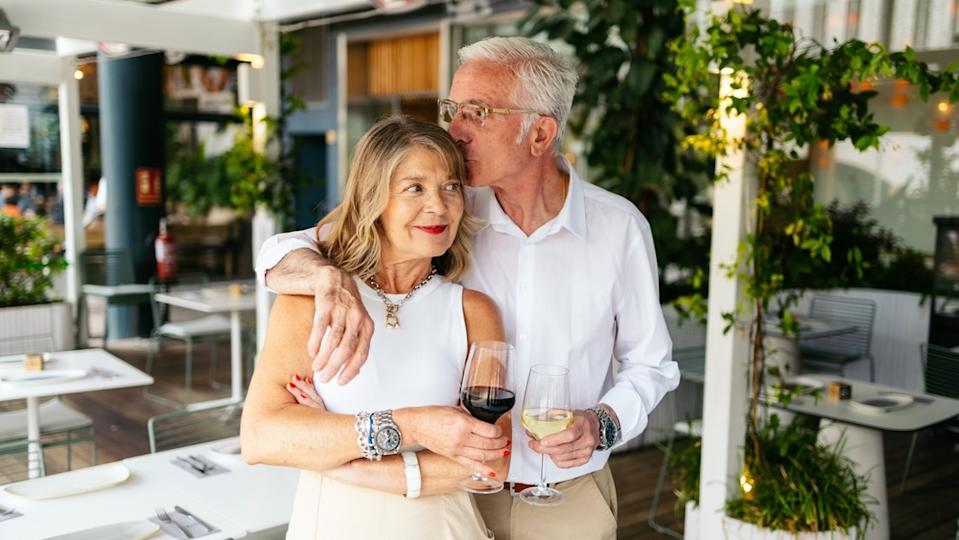 Senior married couple embracing one antoher