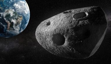 artist's illustration of asteroid apophis, it looks like a giant grey potato, earth is in the upper left corner of the image.