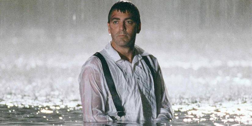 Doug Ross looking forlorn in a suit while standing in water up to his chest in ER season 2 episode 7 "Hell And High Water".