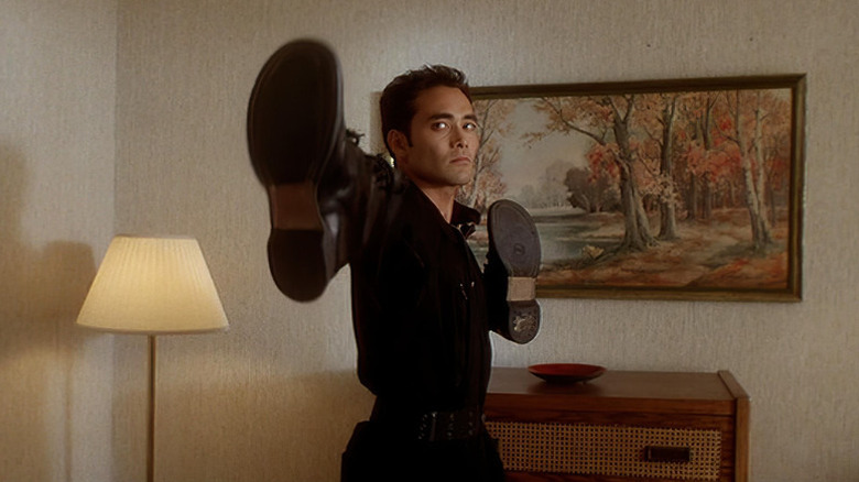 Mark Dacascos as Toby, about to beat up several people with shoes on his hands in Drive