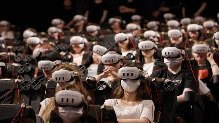 Audience members wear VR headsets while watching a scene from singer Cha Eun-woo's virtual reality concert, 'CHA EUN-WOO VR CONCERT : MEMORIES' at a theater in Seoul, June 2025. Courtesy of AMAZE