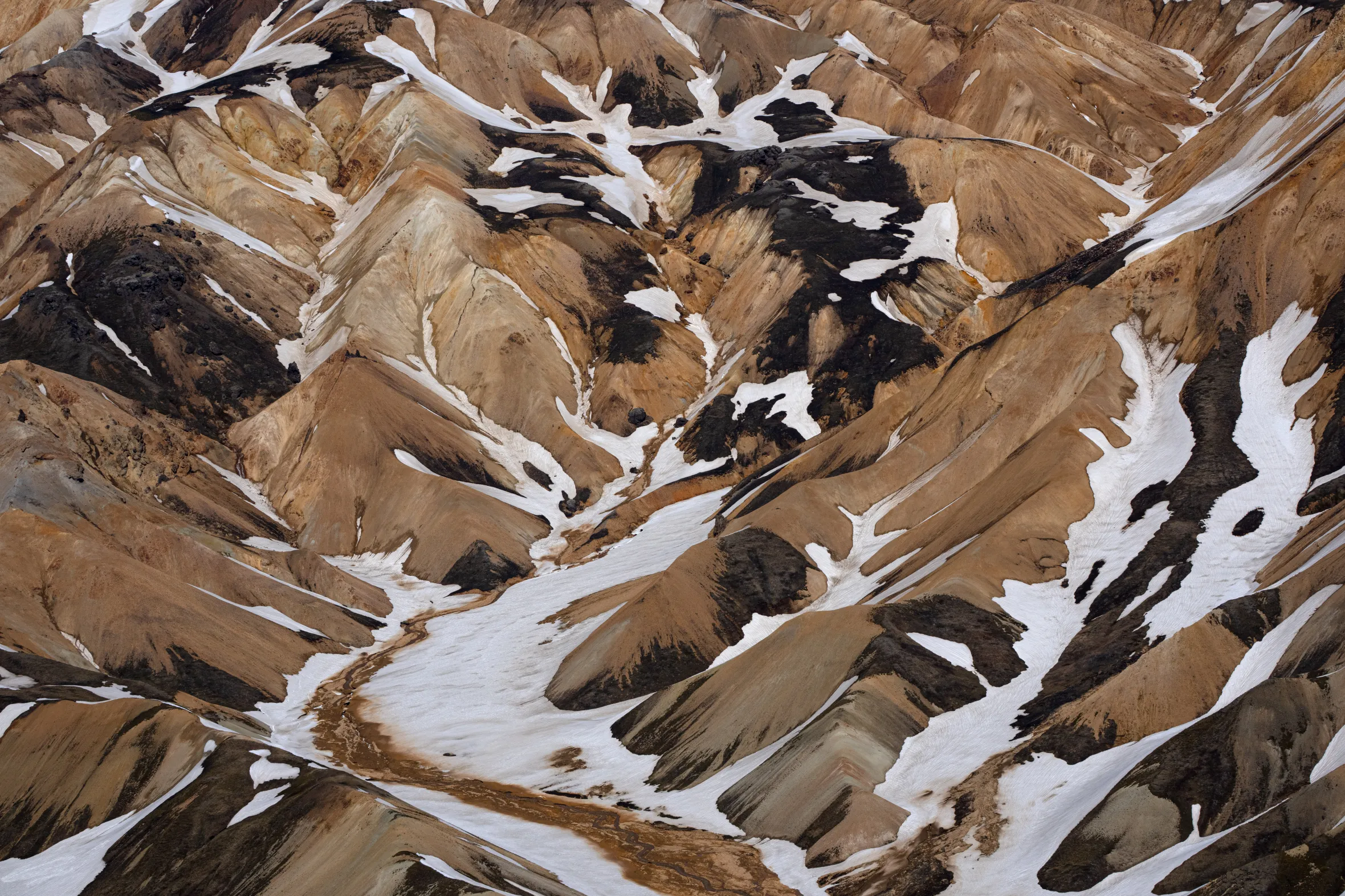 Arctic mountain ranges with snow patterns.