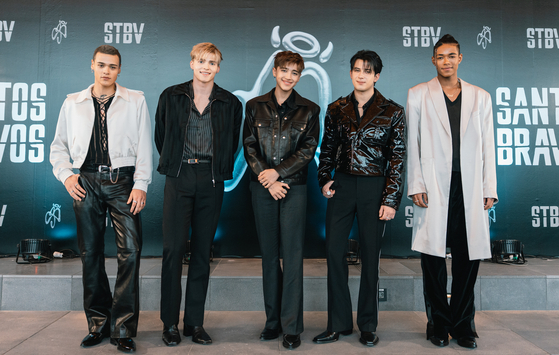 Boy band Santos Bravos poses for photos ahead of a press conference held at HYBE's headquarters in Yongsan District, central Seoul, on April 10. [HYBE]