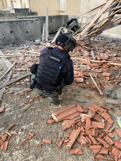 Hezbollah rocket impact site in northern Israel's Misgav Am, Friday.