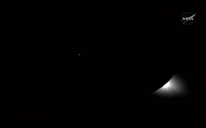 a shimmer of light appears among a screen of black on the bottom right.