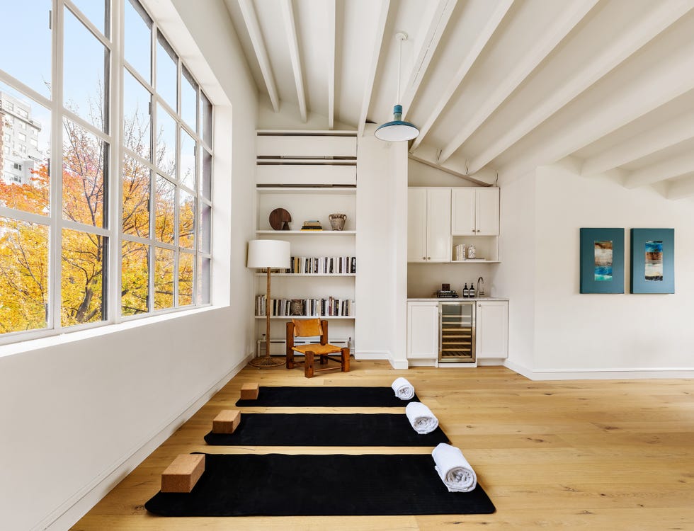 Yoga studio with mats and natural lighting.