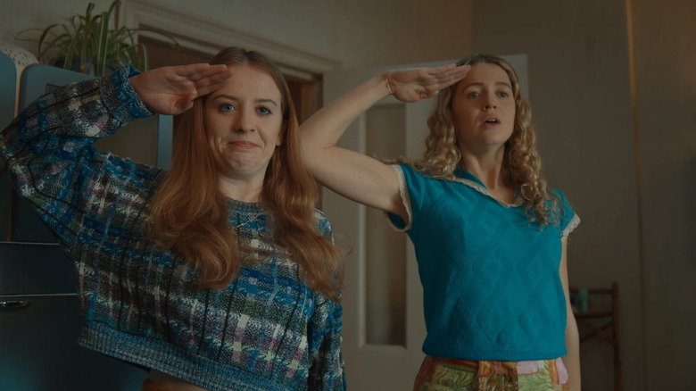 Jen and Carrie saluting in Extraordinary