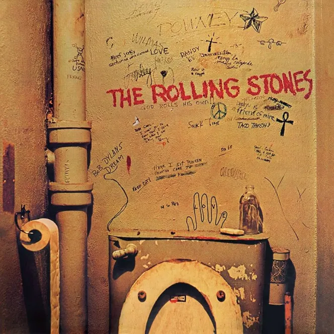 The Rolling Stones album cover for Beggars Banquet, featuring a graffiti-covered toilet wall.