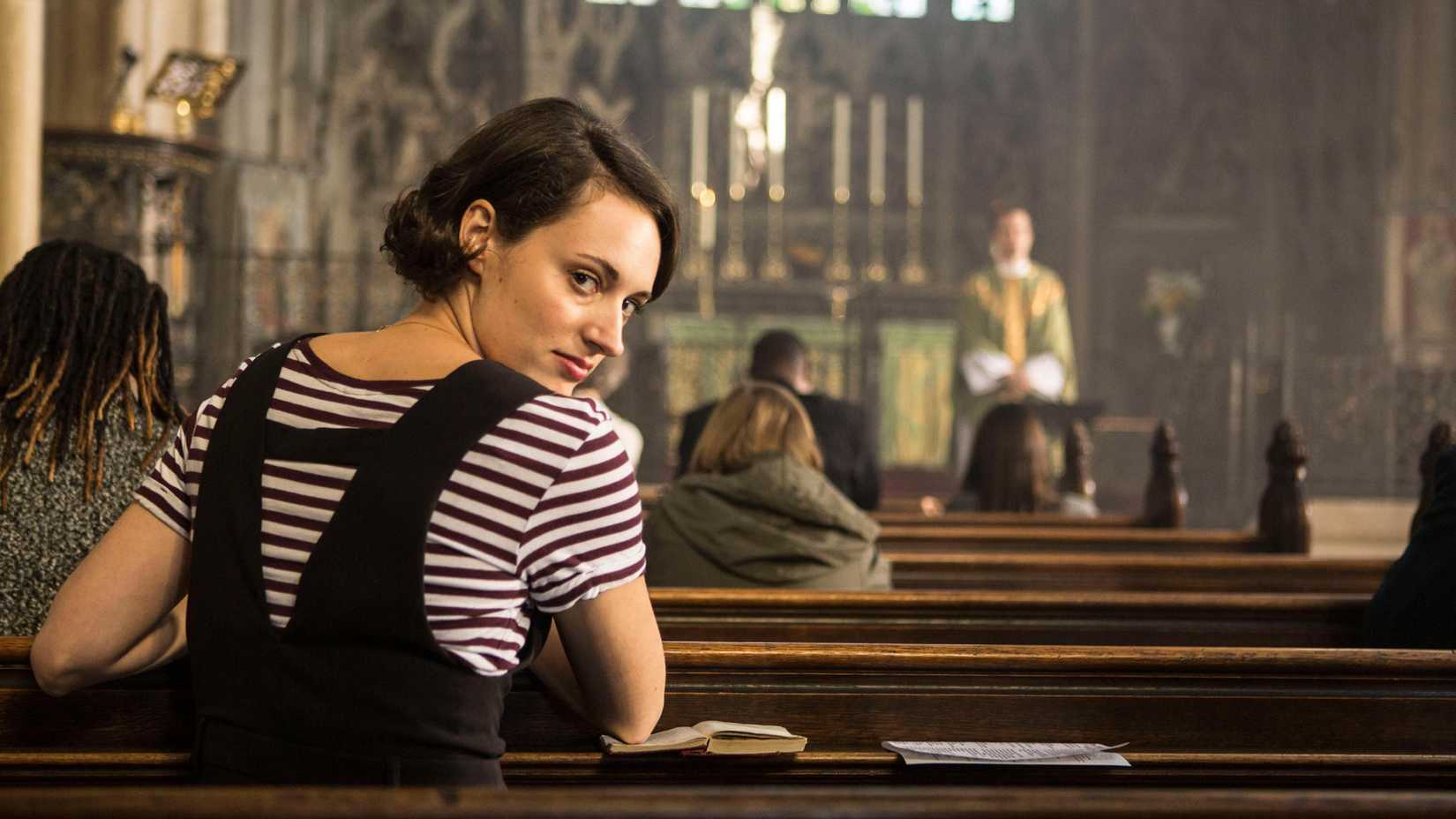 Fleabag looking over her shoulder in a church pew.