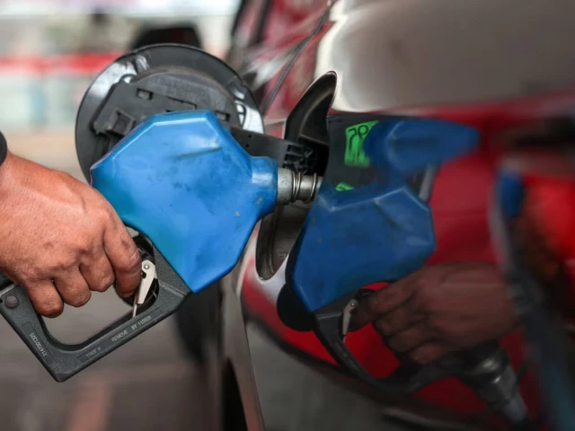 a worker fills a car s tank at a fuel station amid concerns about rising fuel prices linked to the us israel conflict with iran photo reuters file
