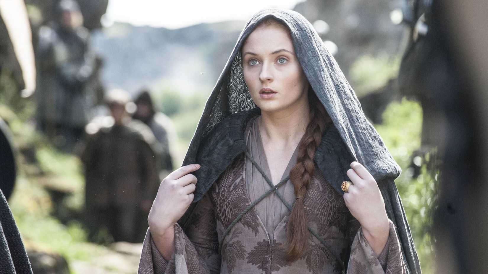 Sansa Stark (Sophie Turner) with a hood over her head in Game of Thrones.