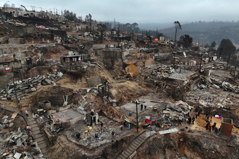 The charred remains of destroyed homes after a wildfire ravaged Lirquén, a town near the city of Concepción, Chile, on January 20, 2026.