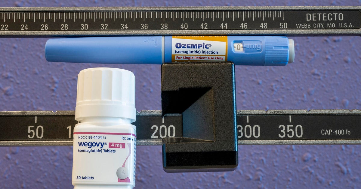 Still life of the new Wegovy 4mg semaglutide tablets with Ozempic injectable pen and weight scale