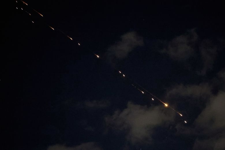 Rocket trails are seen in the sky above the Israeli center coastal city of Netanya amid a fresh barrage of Iranian missile attacks on March 9.