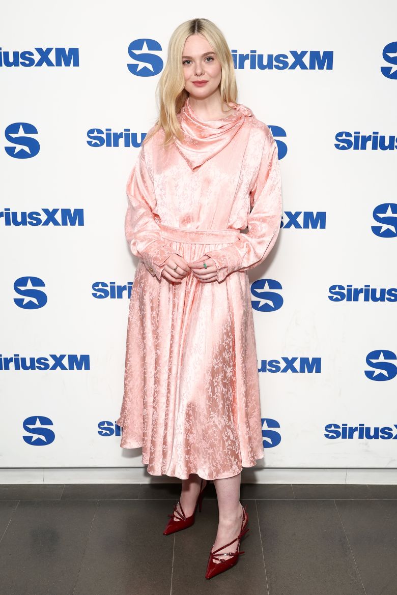 Fanning wore a vintage-style Alberta Ferretti frock to a radio appearance to promote