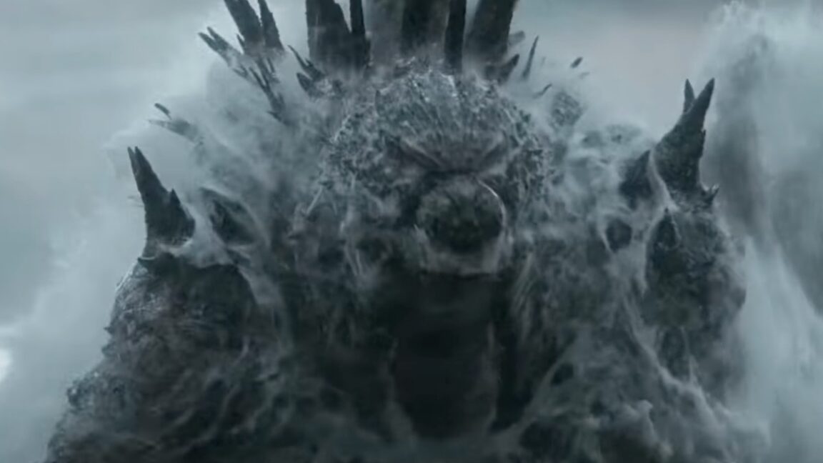 gigantic godzilla monster rising out of the ocean with a great roar