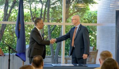 Mark Johnson, left, interim CEO of UNOS, and John Koelling, director of the Aeronautics Research Directorate at NASA's Langley Research Center, shake hands during a signing ceremony marking an agreement to study drone transport for organs.