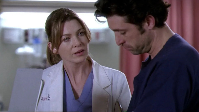 Meredith looking at Derek and speaking