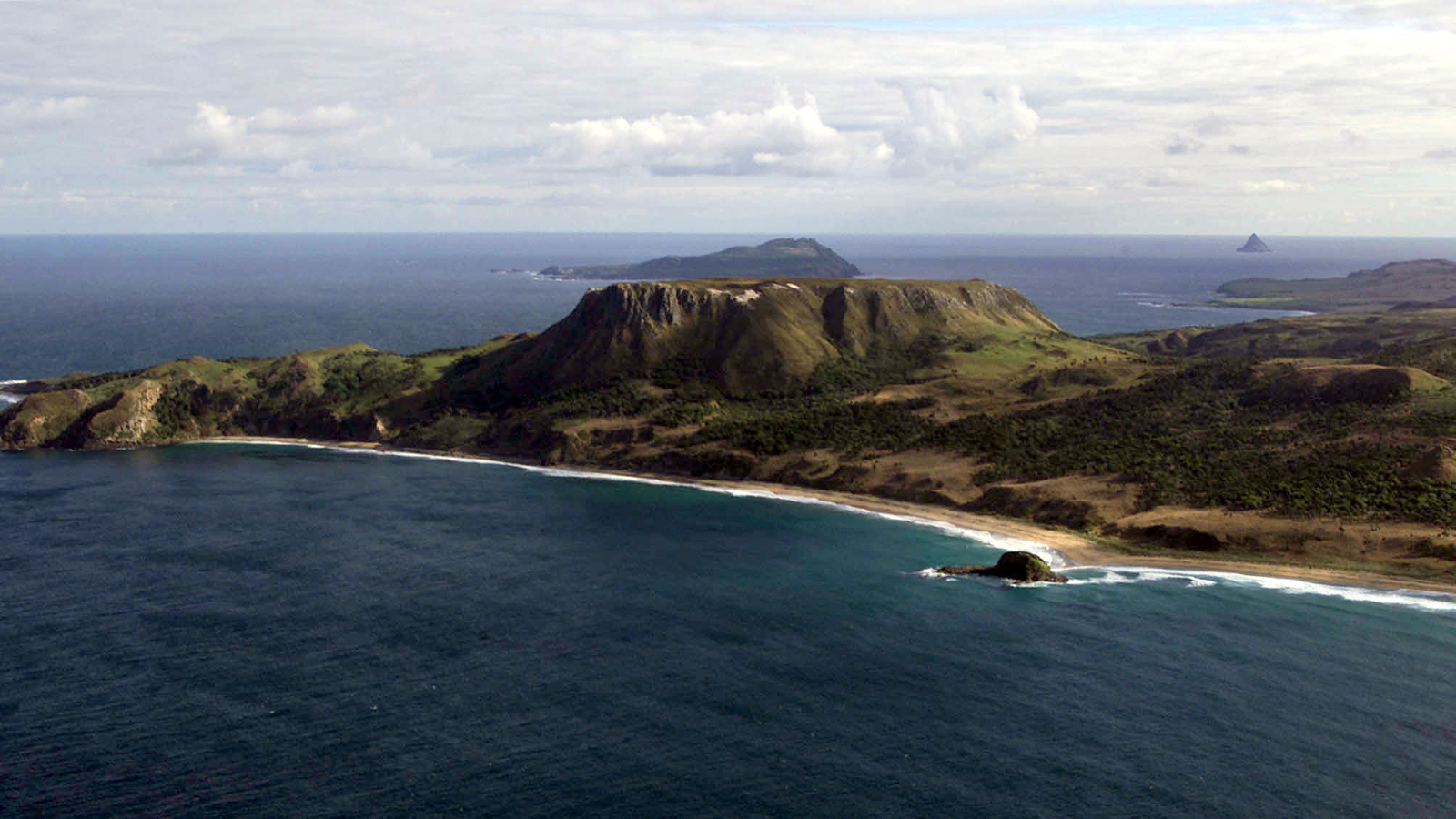 A photo of an island in the sea taken from the air