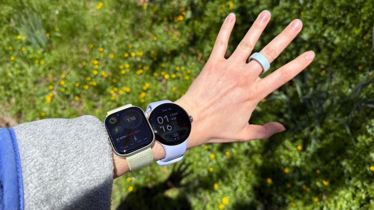 Smartwatches on hand and smart ring on finger
