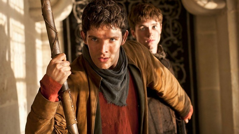 Merlin (Colin Morgan) guards one of Arthur's men on "Merlin"