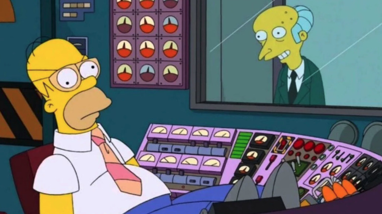Homer Simpson pretends to work while Mr. Burns watches in The Simpsons