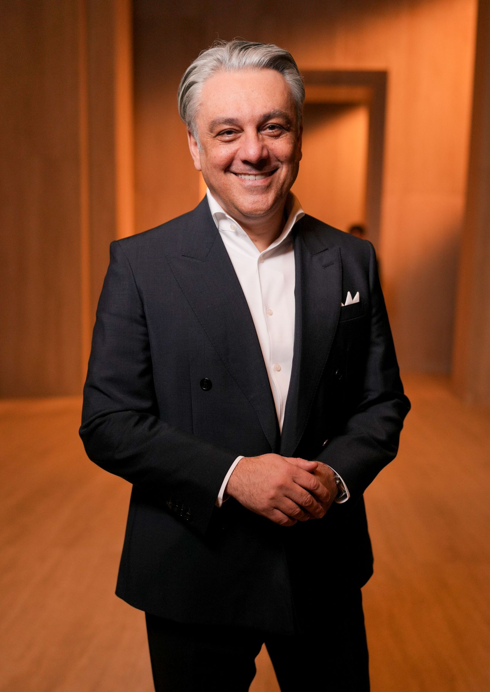 Image may contain Luca de Meo Blazer Clothing Coat Jacket Face Happy Head Person Smile Photography and Portrait