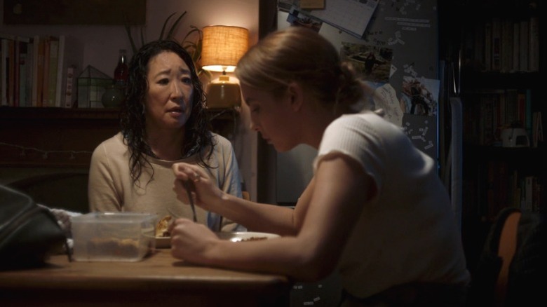 Eve Polastri watching Villanelle eat food in her kitchen on Killing Eve S1E5